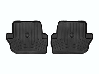 WeatherTech’s Floor Liner HP for Jeep Wrangler 2-Door (2018-, 2nd Row) are black, contoured mats with raised edges and grooves, protecting your interior carpet. Shown side by side on a white background.