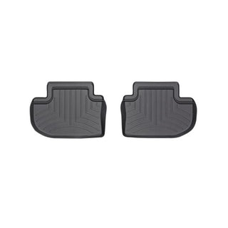 Two black Weathertech Floorliners for the BMW 6 Series Gran Coupe (2012-2018) 2nd row are shown side by side, featuring raised edges and grooves to trap dirt and protect your car’s carpet.