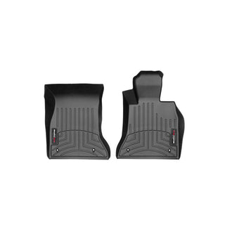 WeatherTech FloorLiner for BMW 5 Series Sedan/Wagon (2014-2017, F10/F11), 1st Row, features two black custom-molded mats with grooved patterns and red and white logo tags, offering premium protection for your car’s interior.