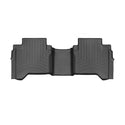 The WeatherTech Floorliner for Toyota Hilux (2016-) 2nd Row is a black, custom-molded car mat with raised edges and grooves for superior protection, fitting contours perfectly to guard against dirt and spills.