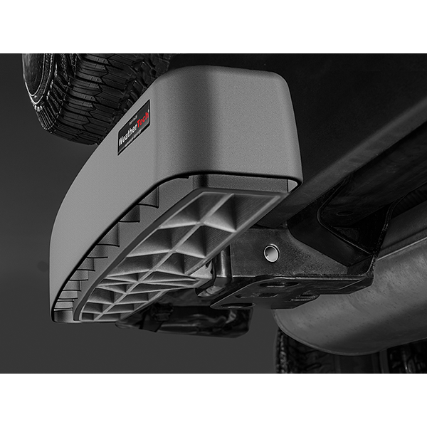 Close-up of a Weathertech BumpStepXL 24 - AU Version (Standard Plated Hitch Hardware) installed on a vehicle, highlighting its textured step surface, bumper protection, and visible tire with undercarriage.