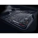 Close-up of a black WeatherTech FloorLiner for BMW 1 Hatch 3dr (F21) 2014-2019 and 2 Series Coupe (F22) 2014-2020, showing water droplets and debris to highlight its superior floor protection in the 2nd row.