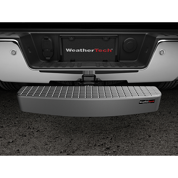 Close-up of the WeatherTech BumpStepXL 24 - AU Version (Standard Plated Hitch Hardware) mounted on a vehicle’s receiver hitch, below the license plate, adding bumper protection and easier access to the truck bed.