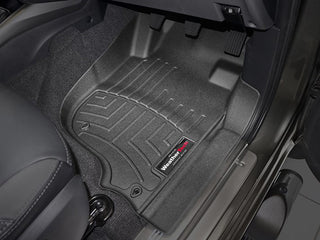 WeatherTech Floorliner for Mitsubishi Triton (2015-, 5th Gen) installed on the front driver side, providing superior carpet protection; pedals and part of the seat are also visible.