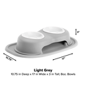 The WeatherTech Double Elevated Pet Feeding System by WeatherTech features two white, 8oz spill-proof bowls in a raised light grey holder (10.75"D x 17"W x 3"H) with a curved base and rim; arrows indicate dimensions.