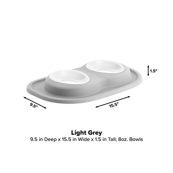 The WeatherTech Double Compact Pet Feeding System by Weathertech features two ergonomic 8 oz bowls on a light grey rectangular base, measuring 9.5" deep, 15.5" wide, and 1.5" tall—a space-saving and stylish solution for pet feeding.