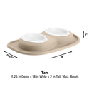 The WeatherTech Double Compact Pet Feeding System features ergonomic bowls on an oval base, measures 11.25" deep x 18" wide x 2" tall, each bowl holds 16 oz, and the color is labeled tan. Arrows indicate width and depth. Brand: WeatherTech.