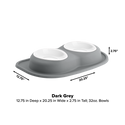 The WeatherTech Double Compact Pet Feeding System by WeatherTech is shown in dark grey with two white 32oz ergonomic bowls, measuring 12.75" D x 20.25" W x 2.75" H on a plain background with labeled dimensions, highlighting its space-saving design.