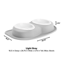 The WeatherTech Double Compact Pet Feeding System in light grey features two ergonomic 96 oz bowls on an oval tray, measuring 16.5" D x 26.75" W x 3.75" H, with dimensions shown by arrows.