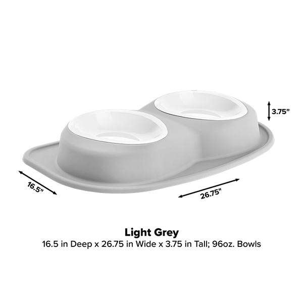 The WeatherTech Double Compact Pet Feeding System by Weathertech features two white ergonomic bowls on a light grey tray (16.5"D x 26.75"W x 3.75"H). Each bowl holds 96 oz, making it a space-saving pet feeder solution.