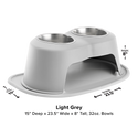 The WeatherTech Double Elevated Pet Feeding System by WeatherTech features two 32 oz ergonomic bowls in light grey, measures 15"D x 23.5"W x 8"H, and has a wide base with curved legs for stability and spill-proof feeding.