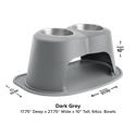 The WeatherTech Double Elevated Pet Feeding System by Weathertech is a dark grey, spill-proof feeder with two stainless steel bowls and built-in tray, measuring 17.75" D x 27.75" W x 10" H, featuring a wide base for added stability.