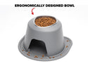 A gray WeatherTech Single Elevated Pet Feeding System with kibble inside features a user-friendly, ergonomic design. Some kibble is scattered near the base, while a red arrow highlights the bowl opening for easy access.