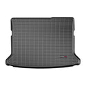 A rectangular, black WeatherTech cargo liner for Mazda CX-3 (2016-2021), with a grid pattern and logo in the lower right, features raised edges for optimal trunk protection and a custom fit.