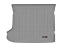 The WeatherTech Cargo Liner for Kia EV6 (2022-) in grey is a custom-fit, textured rectangular mat with a grid pattern and small logo in the bottom right corner, providing superior trunk protection.