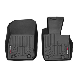 The WeatherTech FloorLiner for Mazda CX-3 (2015-2021) features two contoured black mats with grooves, branded labels, and all-weather protection for driver and passenger front sides to safeguard your interior carpet.