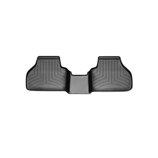 The Weathertech Floorliner for BMW X4 (2010-2018)(F26) and X3 (2010-2017)(F25), 2nd row, features black rubber with raised edges and grooves, delivering superior rear carpet protection. Isolated on a white background.