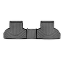 The Weathertech Floorliner for BMW X5 (2013-2018) (F15) 2nd Row is a black, contoured mat with raised edges and grooves, offering superior backseat floor protection from dirt and moisture.