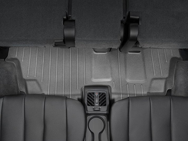 Rear seat view showcasing WeatherTech FloorLiner for BMW X5 (2013-2018, F15) 3rd Row, offering superior floor protection along with visible cup holders, air vents, and backrests—all seen from the rear seats.