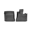 The WeatherTech Floorliner for BMW X5/X6 (E70/E71, 2007-2010) features two black contoured rubber mats with raised edges and grooves, offering durable 1st row interior protection; shown side by side on a white background.