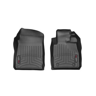 Two black Weathertech Floorliner mats for Ford Fiesta 6th Gen (2011-2017) Manual 1st Row protect your carpet with raised edges and grooves, custom-fit for driver and passenger sides. Displayed on a white background.