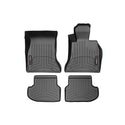 The WeatherTech FloorLiner for BMW 5 Series Sedan/Wagon (2014-2017) F10/F11, 1st row, offers custom-fit black rubber floor protection with raised edges and grooves, designed for superior front seat coverage and shown on a white background.