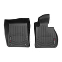 WeatherTech Floorliner mats for BMW 3 Series Sedan (E90/E91/E92/E93, 2005-2014) protect your interior carpet with black, contoured 1st row mats featuring raised edges, textured grooves, and a small branded label in the corner.
