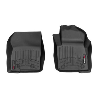 Weathertech Floorliner for Ford Focus Manual (2015-2018), 1st row, features two black molded rubber mats with raised edges and textured grooves for optimal carpet protection. Designed for driver and passenger sides, each mat has a branded corner label.