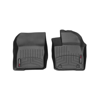 The WeatherTech Floorliner for Ford Focus Auto (2015-2016) 1st Row features two black, contoured mats with raised edges and grooves, providing superior carpet protection and a design similar to classic WeatherTech styles.