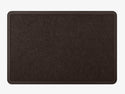 The WeatherTech Carpet Mat by Weathertech is a rectangular dark brown entrance mat with a textured fabric surface and slightly raised border, displayed on a light gray background.