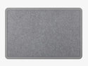 The WeatherTech Carpet Mat by Weathertech is a rectangular, gray fabric desk mat with rounded corners and a darker gray border, styled like a commercial-grade doormat and shown on a light gray background.