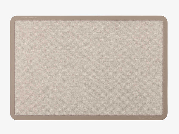 The WeatherTech Carpet Mat by Weathertech is a rectangular beige entrance mat with a darker beige border, featuring a subtle textured pattern, displayed on a light gray background.