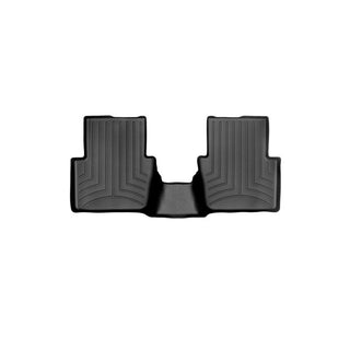 The Weathertech Floorliner for Mazda CX-3 (2015-2021) 2nd row is a black, contoured mat with raised edges and textured grooves, designed to protect your rear interior carpet with a central hump connecting two larger sections.