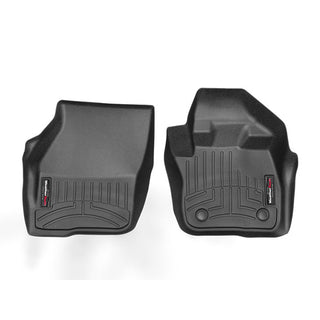 The Weathertech Floorliner for Ford Mondeo (2014-, 1st Row) includes two black, custom-fit mats with raised edges and grooves, plus a red and white logo label—designed to protect your front driver and passenger side carpets.