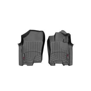 The Weathertech Floorliner for Nissan Navara (2016-2020) - 1st Row, shown in black on a white background, features custom fit, raised edges, and textured surfaces to protect your front interior carpet and keep it clean.